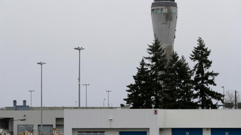 Police search for fugitive who escaped from Seattle's airport in handcuffs