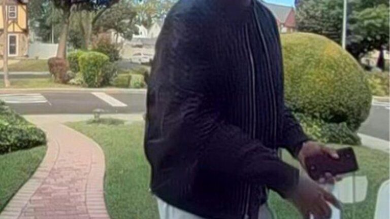 New York City police hunt for man suspected of killing elderly couple and burning their home