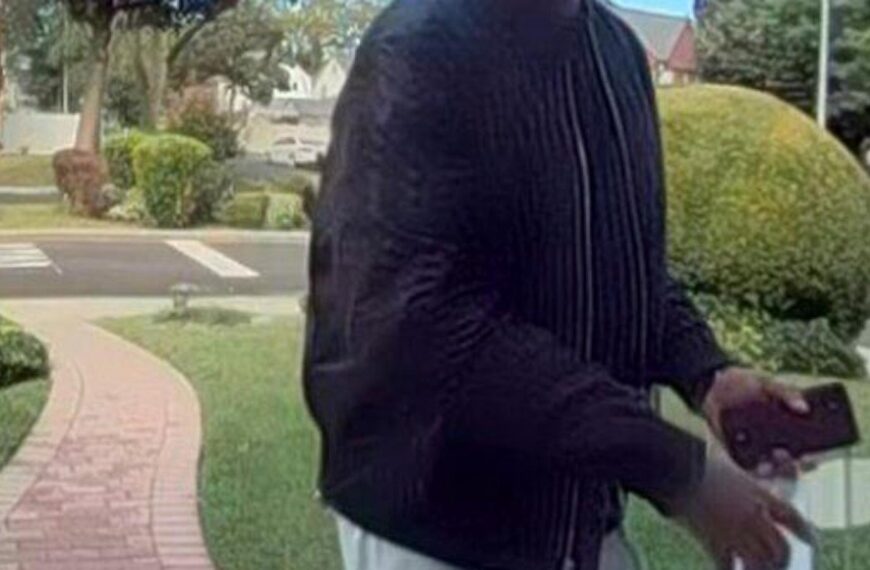 New York City police hunt for man suspected of killing elderly couple and burning their home