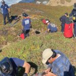 A San Francisco dog kisses rescuers after it’s plucked from the side of a cliff