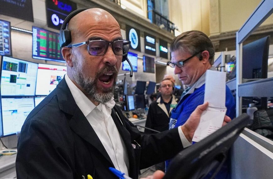 US futures slip and Asian stocks are mixed, while oil prices surge more than $1 a barrel