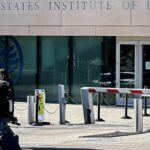 Trump is fighting the Institute of Peace in court. Now, his name is on the building