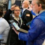 World shares are mostly lower in quiet holiday trading as China stages war drills near Taiwan