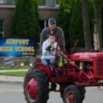Michigan seniors arrive at school in style on Tractor Day