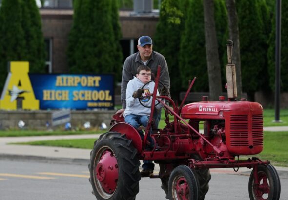 Michigan seniors arrive at school in style on Tractor Day