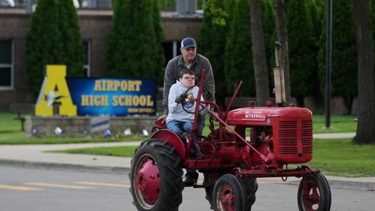 Michigan seniors arrive at school in style on Tractor Day