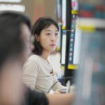 Asian markets are mixed and oil is steady after Wall Street hits records