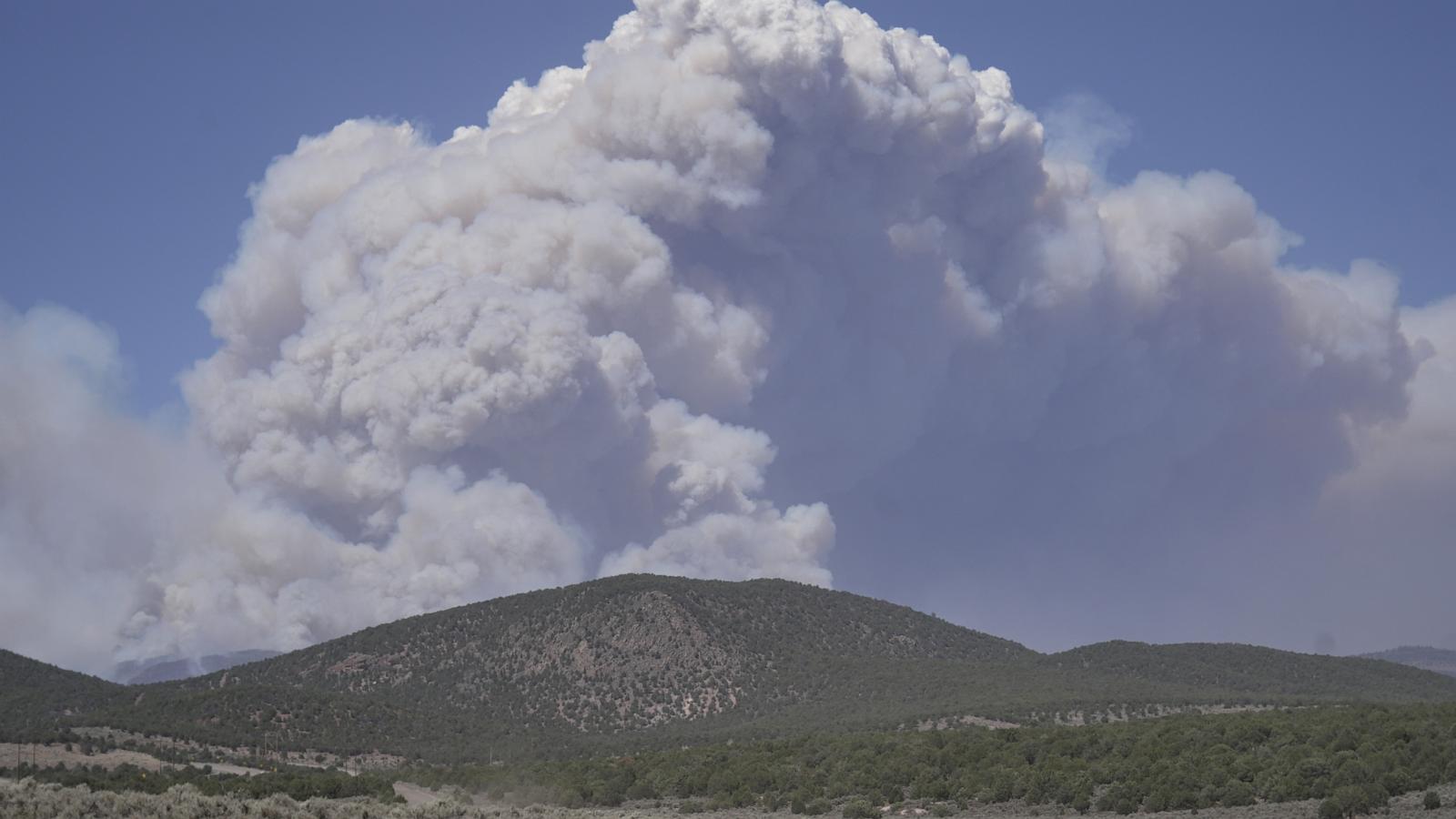 Dangerous weather hampers firefighters and leads to fireworks bans in western US
