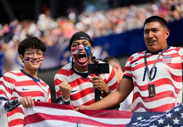 Roaring crowds in stars and stripes show up for the US team, and soccer's moment in their country