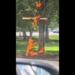 Police are investigating a large burning cross at a Chicago park