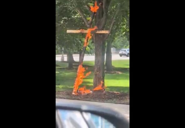 Police are investigating a large burning cross at a Chicago park