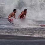 California lifeguard is hailed as a hero after rescuing a boy from pounding surf