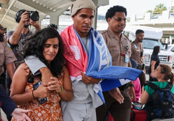 Cuban artist and dissident exiled from country after 5 years in prison arrives in U.S.