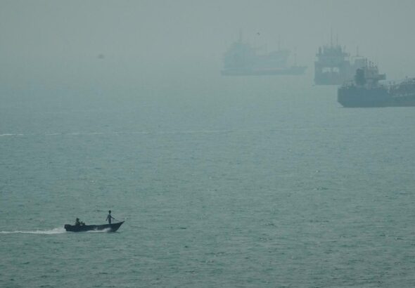 An Iranian commercial ship is struck near Strait of Hormuz with 1 dead, Iranian media say