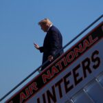 CNN says it was left off Air Force One for Trump's Saturday trip to a college football game