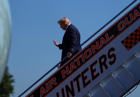 CNN says it was left off Air Force One for Trump's Saturday trip to a college football game