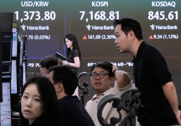 Global benchmarks mostly rise after Wall Street's rally