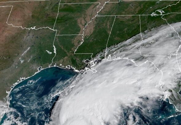 El Niño's storm-killer winds and climate's warming waters in fight over future of Hurricane Isaias